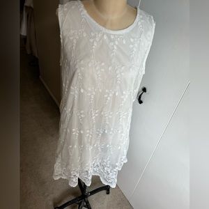 White dress with embroidered overlay. Gently worn no stains or snags